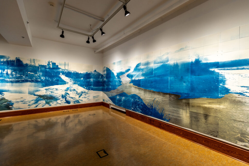 Install shot of the 30 ft artwork, wrapping along the wall and along the corner. Images are form Edmonton and surrounding areas, including iconic landmarks, urban places, industry, glacier and river ice, and the Saskatchewan Glacier (part of the headwaters of the North Saskatchewan)